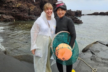 Traveler with a Jeju haenyeo diver